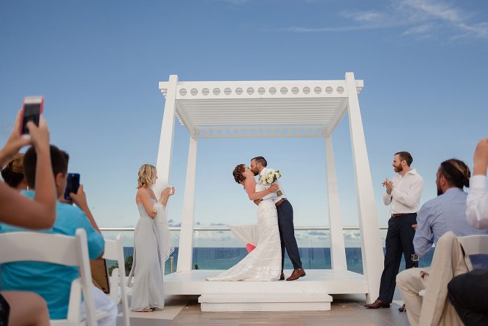 Bride and grooms first kiss at Azul Fives Sky Deck