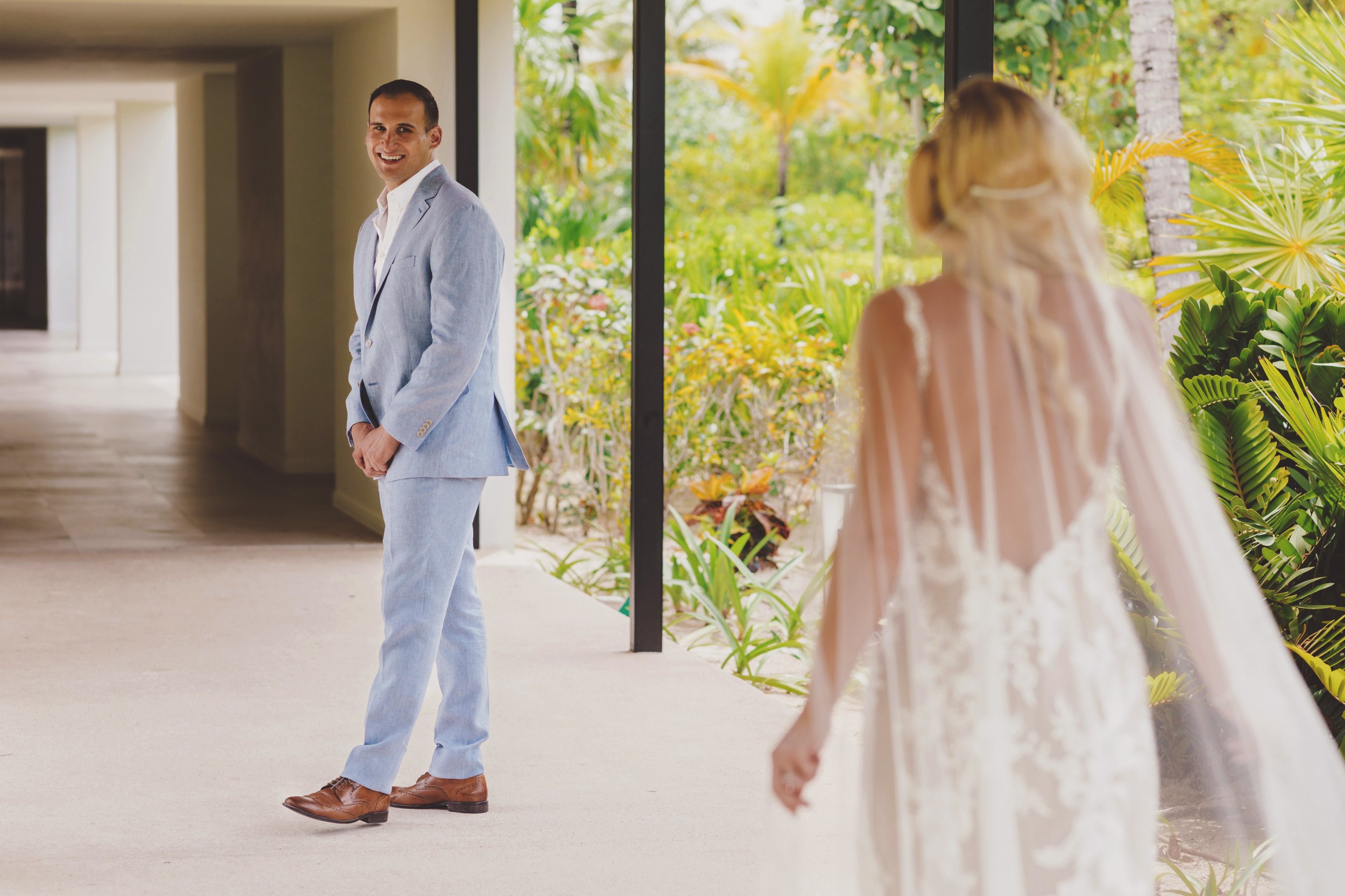 Groom seeing the bride for the first time at her wedding in Cancun
