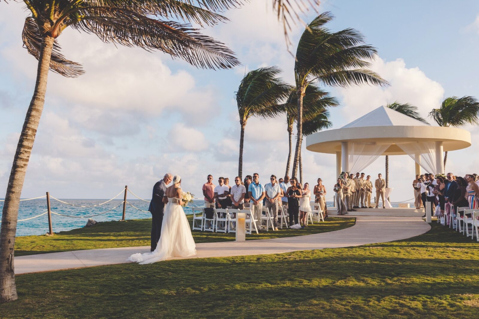 Bride walking to ceremony location in Riviera Maya Mexico